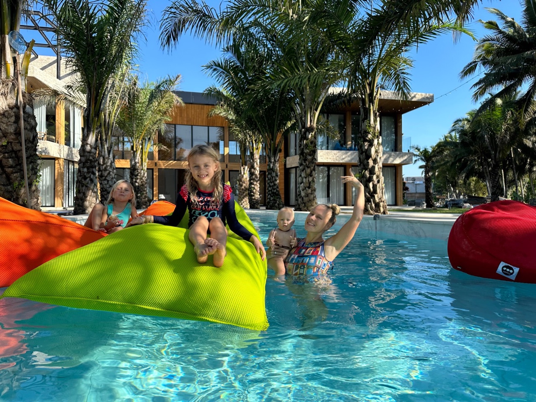 Family enjoying the Bali villa pool