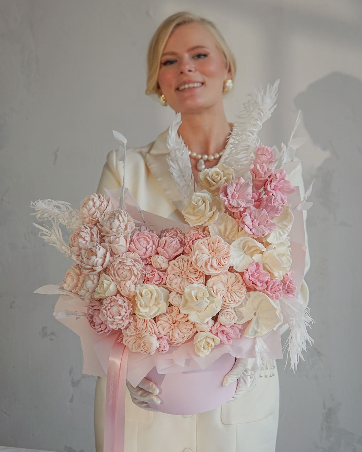 Stacy Maxwell holding a bouquet of molded edible flowers